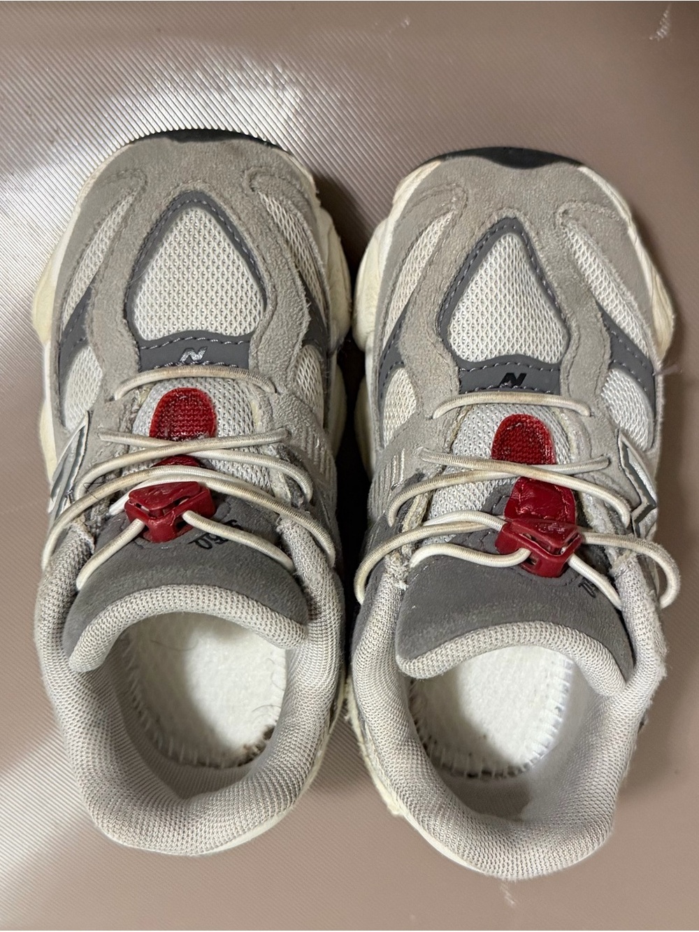New Balance Kids Grey Sneakers with Red Accents.          (NO INSOLE)